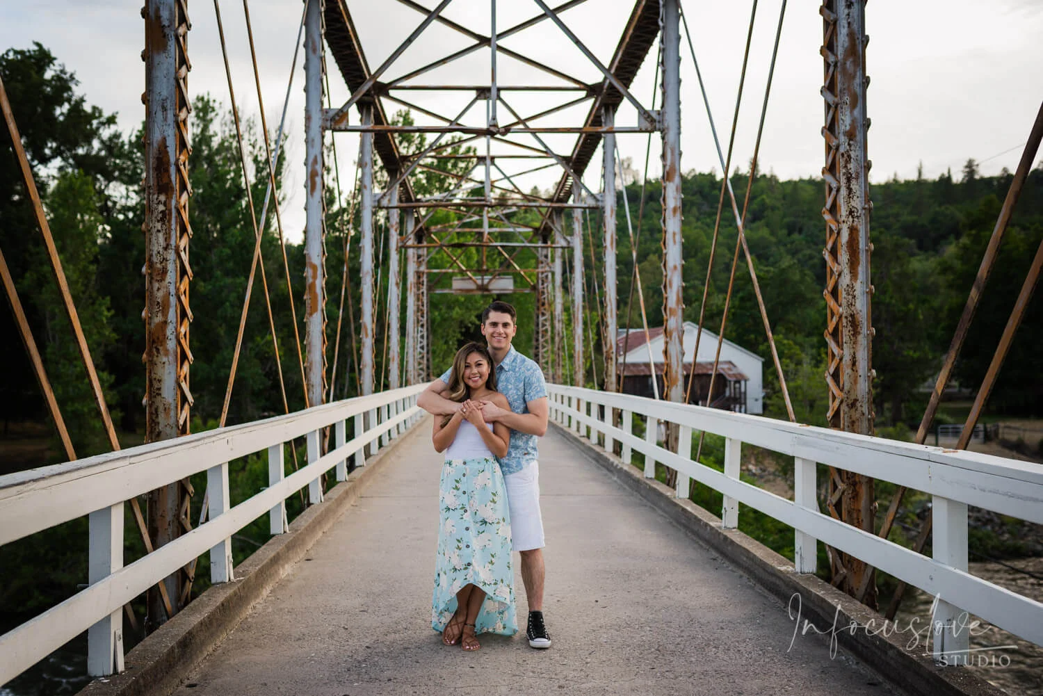 A couple walking across a footbridge